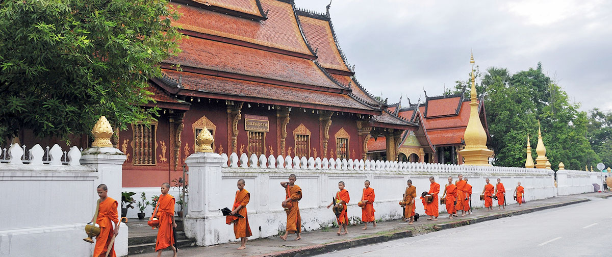 Monks are walking in Luang Prabang