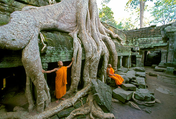 Two monks standing in the Angkor Wat