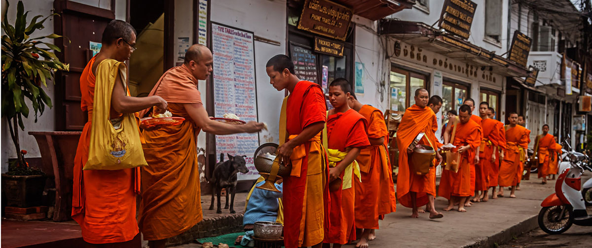 Laotian monks are receiving monks in Luang Prabang